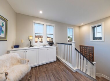 M-landing-at-top-of-stairs,-large-laundry-room-to-the-left